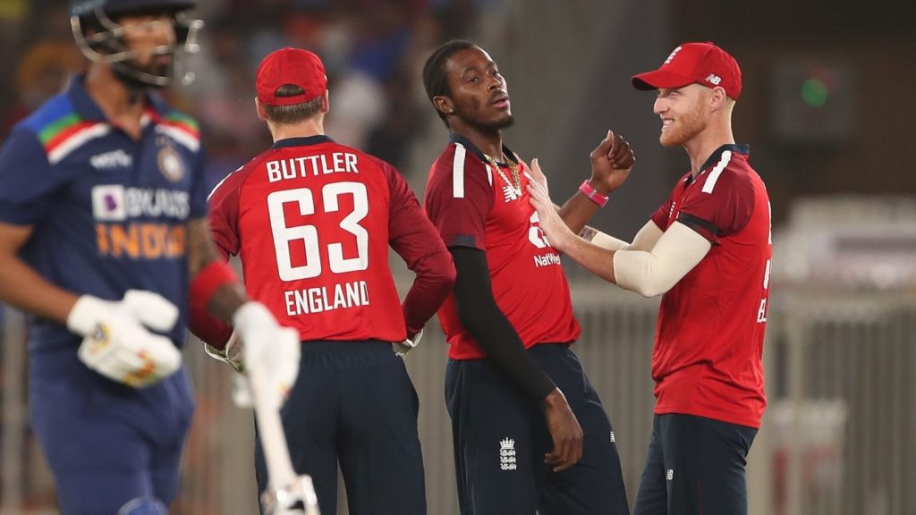 AHMEDABAD, INDIA - MARCH 12: Jofra Archer of England celebrates after taking the wicket of KL Rahul of India with team mate Ben Stokes (R) during the 1st T20 International match between India and England at Sardar Patel Stadium on March 12, 2021 in Ahmedabad, India. (Photo by Surjeet Yadav/Getty Images)