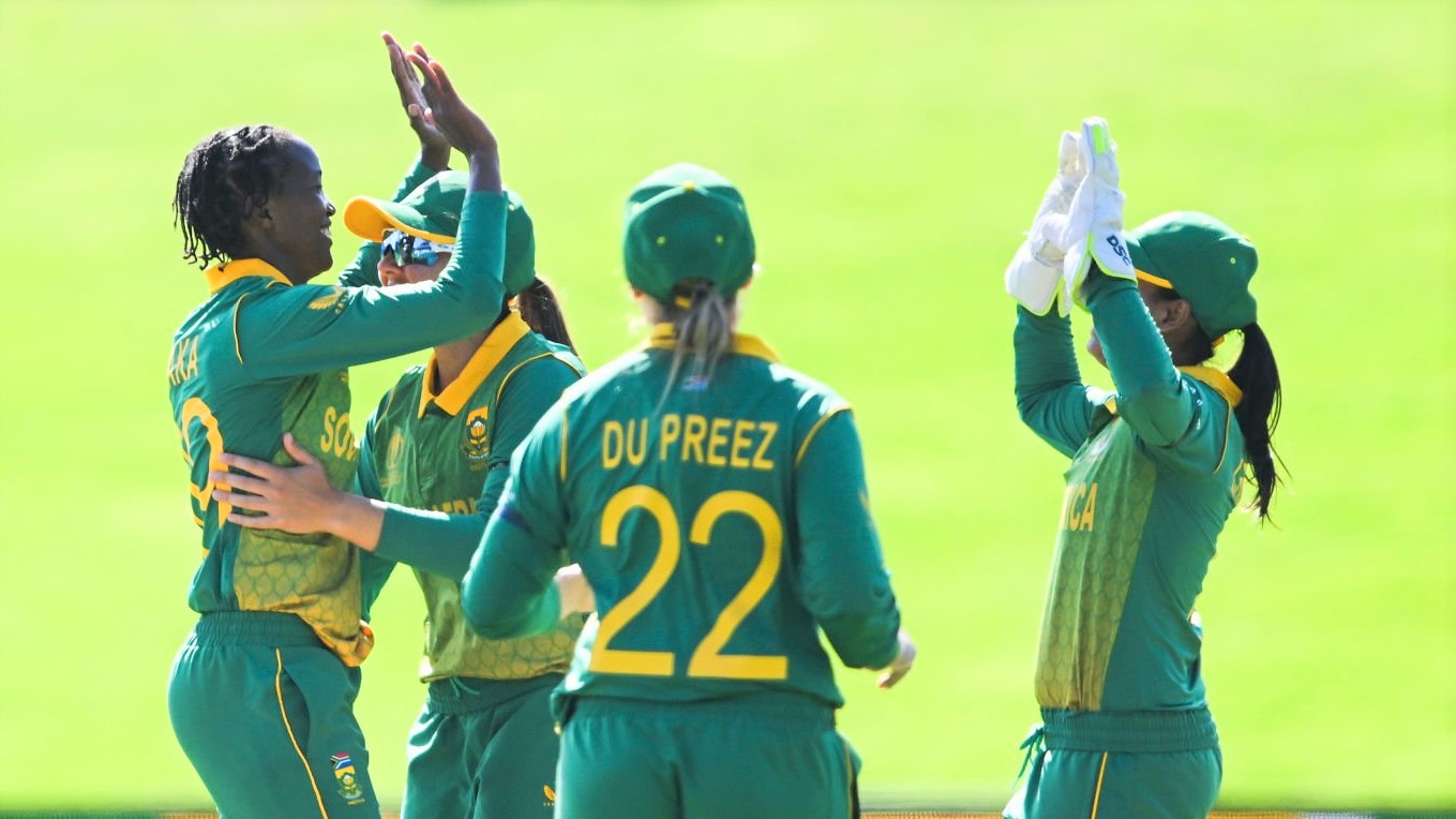 DUNEDIN, NEW ZEALAND - MARCH 05: Ayabonga Khaka of South Africa celebrates with team mates after dismissing Murshida Khatun of Bangladesh during the 2022 ICC Women's Cricket World Cup match between Bangladesh and South Africa at University Oval on March 05, 2022 in Dunedin, New Zealand. (Photo by Joe Allison-ICC/ICC via Getty Images)