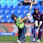 Curtis Campher in action for Ireland against Scotland at the T20 World Cup