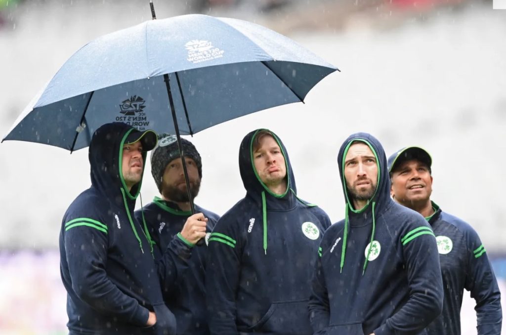 Ireland players take shelter from the rain at the T20 World Cup