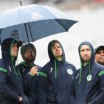 Ireland players take shelter from the rain at the T20 World Cup