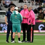 Jos Buttler and Aaron Finch chat with the umpires