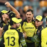 Mitchell Starc celebrates with his Australia teammates