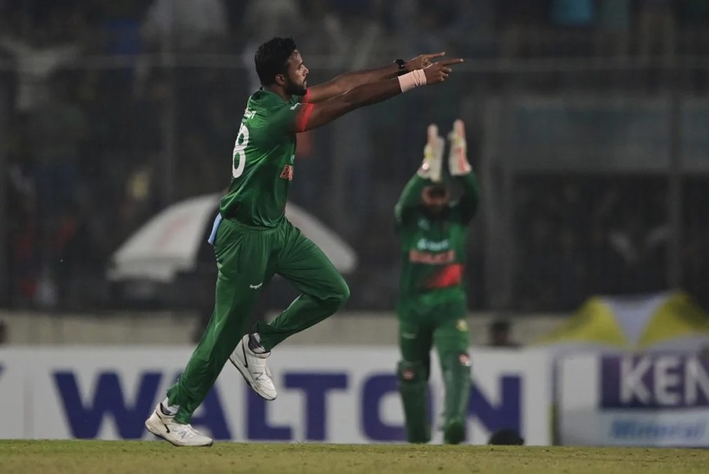 Ebadot Hossain wheels away in celebration after dismissing Axar Patel