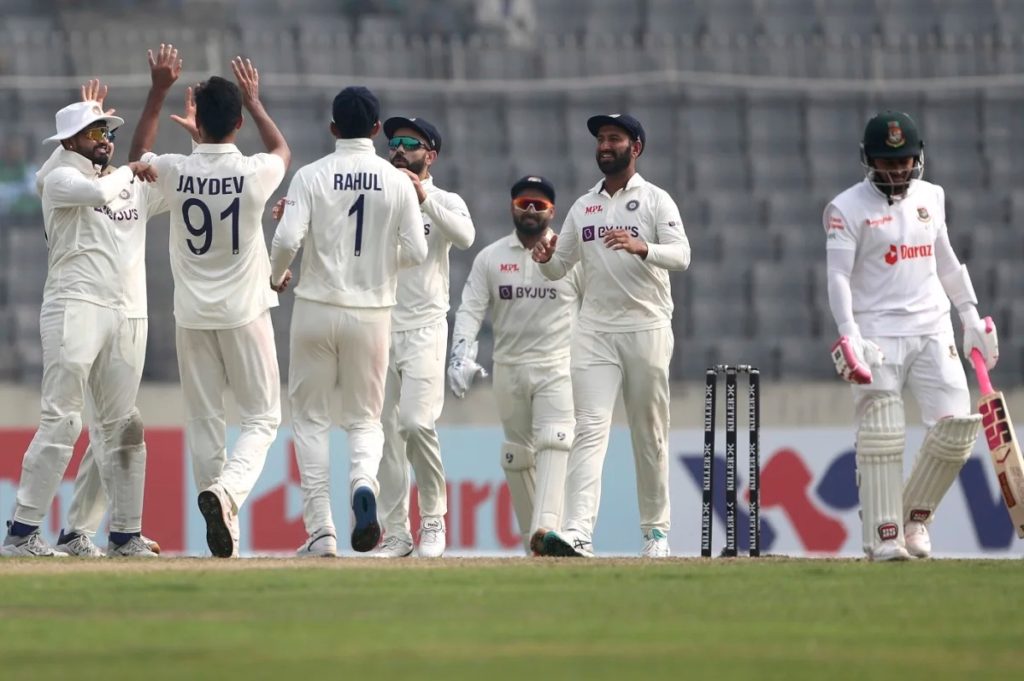 Jaydev Unadkat celebrates with India after taking a wicket