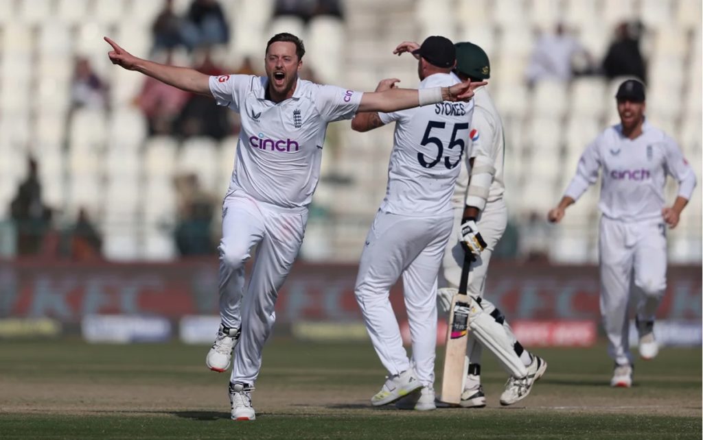 Ollie Robinson celebrates taking the winning wicket against Pakistan