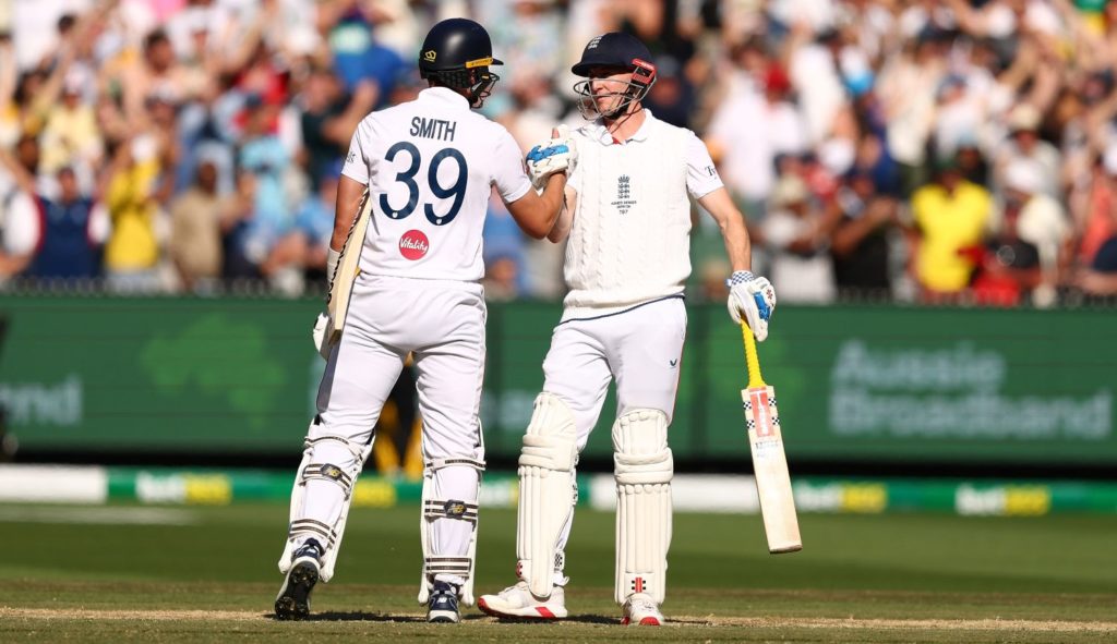 MELBOURNE, AUSTRALIA - DECEMBER 27: Jamie Smith of England and Harry Brook of England celebrate victory during day two of the Fourth Test in the 2025/26 Ashes Series between Australia and England at Melbourne Cricket Ground on December 27, 2025 in Melbourne, Australia. (Photo by
