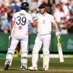 MELBOURNE, AUSTRALIA - DECEMBER 27: Jamie Smith of England and Harry Brook of England celebrate victory during day two of the Fourth Test in the 2025/26 Ashes Series between Australia and England at Melbourne Cricket Ground on December 27, 2025 in Melbourne, Australia. (Photo by
