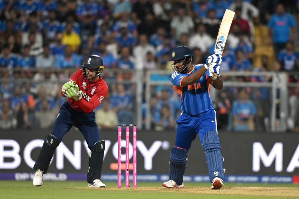 MUMBAI, INDIA - MARCH 05: Sanju Samson of India bats watched by England wicketkeeper Jos Buttler during the ICC Men's T20 World Cup India & Sri Lanka 2026 Semi-Final match between India and England at Wankhede Stadium on March 05, 2026 in Mumbai, India. (Photo by Prakash Singh/Getty Images)